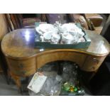 A Burr walnut kidney shaped dressing table by golden key