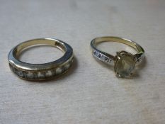 9ct yellow gold pale sapphire set ring and a similar eternity example, both size O, marked 375, gros