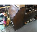 A mahogany bureau on narrow proportions with four drawers