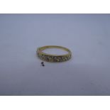 18ct yellow gold band ring set with 9 diamonds, marks worn, size P, 2.2g
