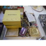 A tray of mixed costume jewellery including silver necklace, brooches, a boxed smartwatch etc