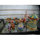 Collection Winnie The Pooh ornaments, figure from the Juliano collection and vintage musical carouse