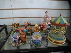 Collection Winnie The Pooh ornaments, figure from the Juliano collection and vintage musical carouse