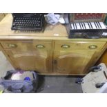 A Victorian stripped pine sideboards with two drawers and cupboard on turned supports