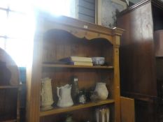 A waxed pine open floor standing bookcase