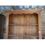 Pine dresser with 3 shelves and two drawers over cupboards