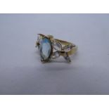 9ct yellow gold dress ring set with central blue topaz and floral set rainbow moonstones, marked 375