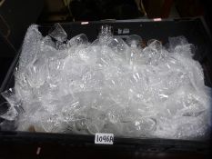 A large crate containing a large amount of cut glasses