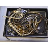 A collection of silver and other costume jewellery comprising a white metal snake bangle, Indian bro