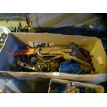 A box of various vintage tools including metal planes, saws, clamps etc