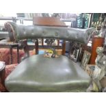 An antique mahogany framed circular tub chair with green leather back and seat af