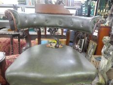 An antique mahogany framed circular tub chair with green leather back and seat af