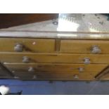 A Victorian chest of drawers stripped pine on supports