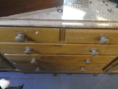 A Victorian chest of drawers stripped pine on supports