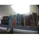 A shelf of various reference books on art and history