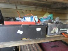 Two shelves of garage clearance items including a coal scuttle, Dr martin boots, Mitre box and saw e