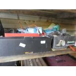 Two shelves of garage clearance items including a coal scuttle, Dr martin boots, Mitre box and saw e