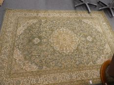 A pale green and cream Chinese design carpet with central motif