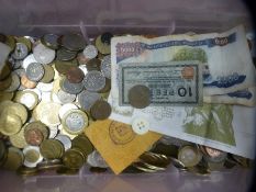 A box of various GB and world coinage and bank notes