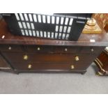 A stag chest of drawers with four mini above two long drawers