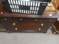A stag chest of drawers with four mini above two long drawers