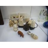 A collection of Oriental wooden and bone carved Netsuke to include figures, animals etc