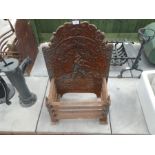Cast iron fire grate with decorative high back