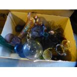 A crate of mixed coloured glassware including carnival vase and Murano fish