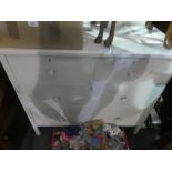 A white painted dressing table with two short and two long drawers