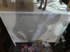A white painted dressing table with two short and two long drawers