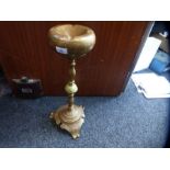 A pair of brass floor standing ashtrays