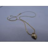 14K yellow hold fine flat neck chain hung with a heart shaped pendant, 1.1g, marked 14K