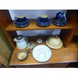 A collection of studio pottery including bee hive design cheese dish, candle sticks and a quantity o