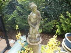 Stone effect garden statue of a lady on a plinth