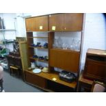 A mid century teak wall unit with cupboard, open shelf and sliding cupboard by G plan