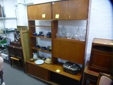 A mid century teak wall unit with cupboard, open shelf and sliding cupboard by G plan