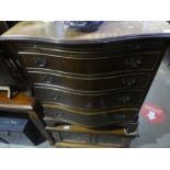 A mahogany serpentine chest of four doors and an old charm style TV cabinet