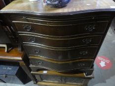 A mahogany serpentine chest of four doors and an old charm style TV cabinet