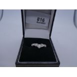 18ct white gold wishbone design graduated diamond 7 stone ring, the central diamond 0.25 carat