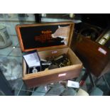 Mahogany box containing a Monocular, Binoculars and games box. A box containing military badges and
