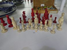19th Century ivory chess set accompanied by a smaller similar set in mahogany box