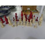 19th Century ivory chess set accompanied by a smaller similar set in mahogany box