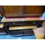 A vintage red leather top two drawer top desk