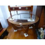A mid century teak circular coffee table by G plan with glass insert