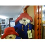 A large Paddington Bear teddy and a similar smaller example