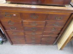 An antique mahogany multi drawer unit with eighteen drawers