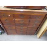 An antique mahogany multi drawer unit with eighteen drawers