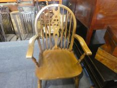 A set of six modern wheelback dining chair including two carvers