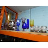 A collection of coloured glass vases