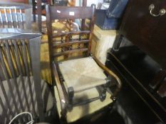 A Mahogany framed rush seat arm chair, similar stool and a barley twist lamp